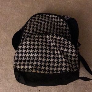 I’m selling a black And white kids backpack